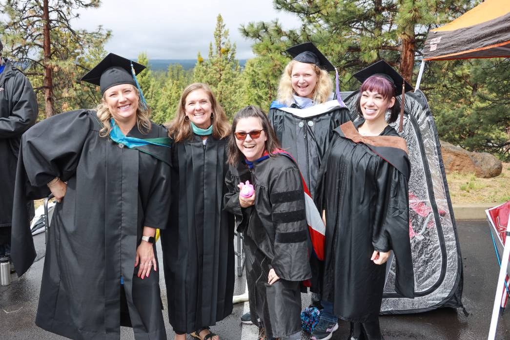 Faculty Celebration Several faculty celebrating at commencement