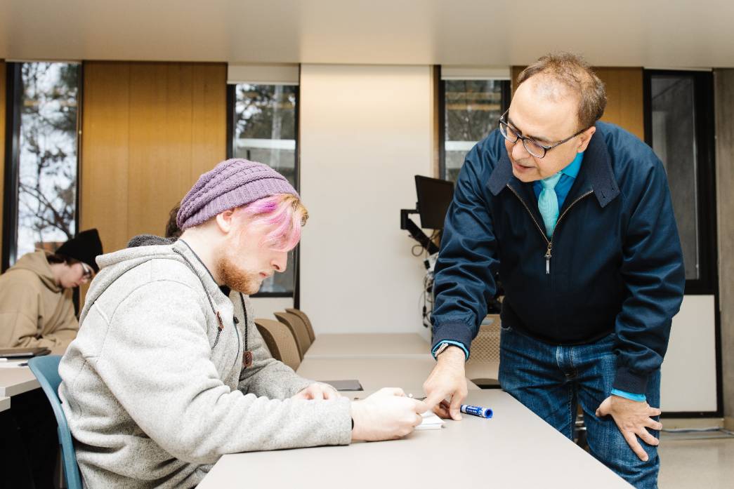 Faculty Evaluation Professor helping a student