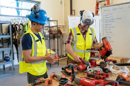 Pre-Apprenticeship student and instructor discuss power tools in class