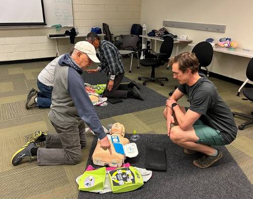CPR student practicing with AED