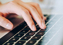 Hands on a computer keyboard