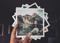 A hand holding photos