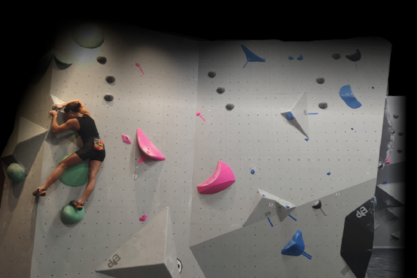 rock climber on gray wall