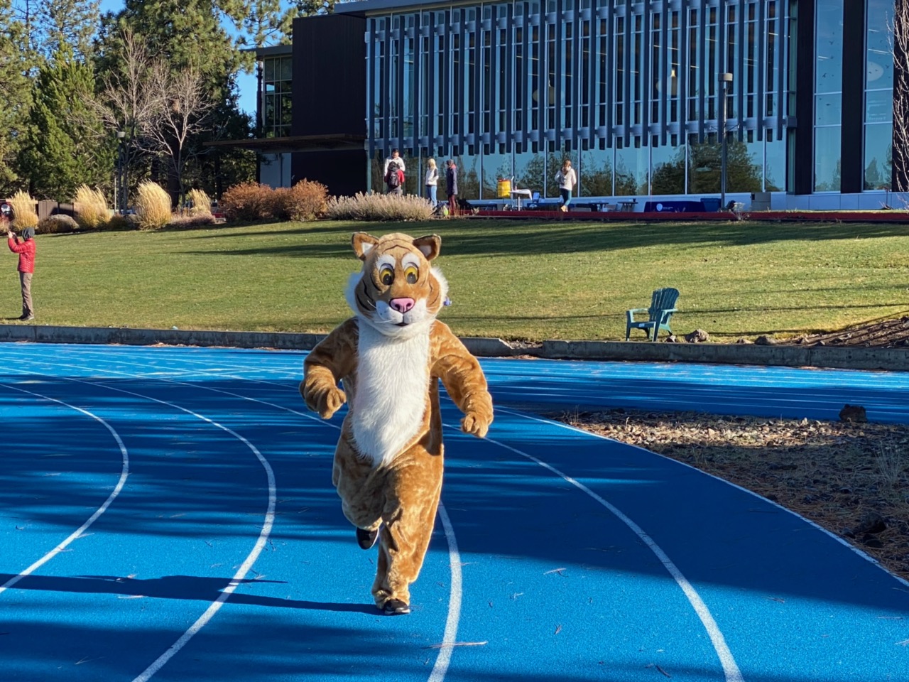 Bobcat Mascot running on track