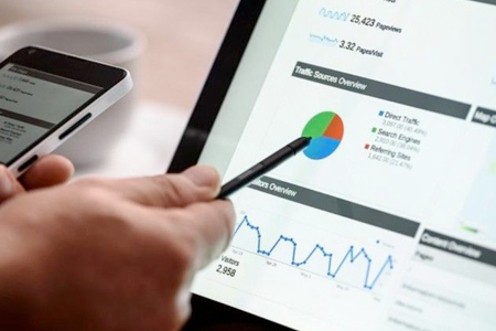 CIS Careers - hand with stylus pointing at a pie chart on a computer monitor